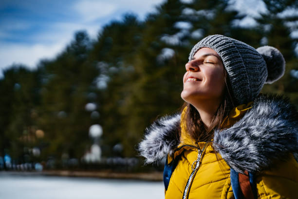 istock Happy Woman Enjoying The Sunlight On A Snowy Mountain 1714961021