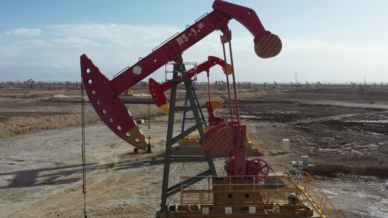 Close-up of pumping unit in oil field in desert