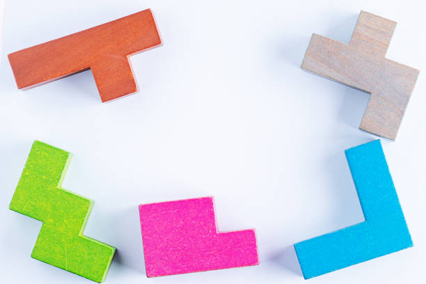 istock Concept of creative, logical thinking. Different colorful shapes wooden blocks on white background, flat lay, copy space. Geometric shapes in different colors, top view. Abstract Background. 1714963431