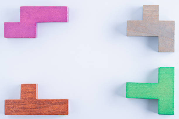 istock Concept of creative, logical thinking. Different colorful shapes wooden blocks on white background, flat lay, copy space. Geometric shapes in different colors, top view. Abstract Background. 1714963435