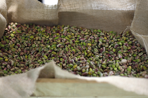 pistachios in wooden box for sale in the market