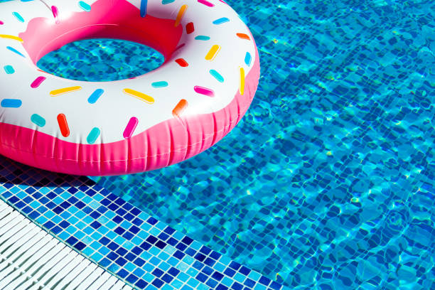 istock Inflatable ring with doughnut design. Concept of summer vacation fun 1714964549