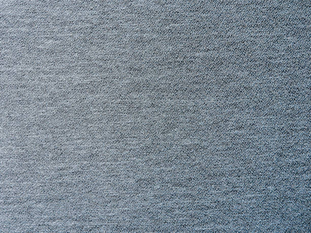 Abstract fabric backdrop. Texture, background, pattern. Close-up of gray fabric.