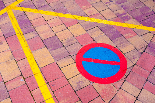 Traffic sign painted on the ground no parking.