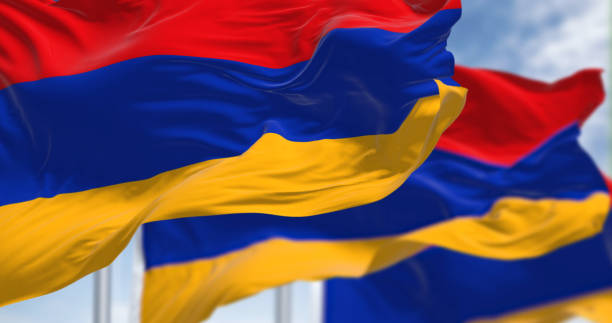 three armenia national flags waving in the wind - ermeni bayrağı stok fotoğraflar ve resimler