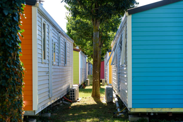 istock Wooden bungalows inside a summer campsite with brightly painted boards. 1714991766