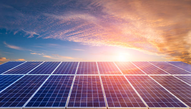 istock Solar panels and nature background at sunrise 1714991897