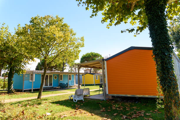 istock Wooden bungalows inside a summer campsite with brightly painted boards. 1714991904