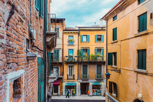 Verona, italy - october 1, 2021: alleys of Verona among which you can see the duomo and the castle.