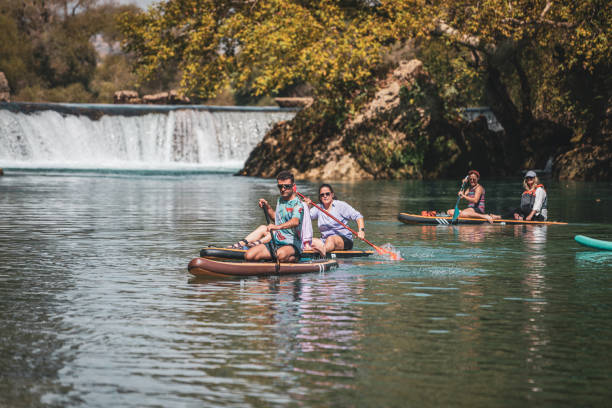 istock Group of Friends Paddle Boarding (sup) on River 1715000370