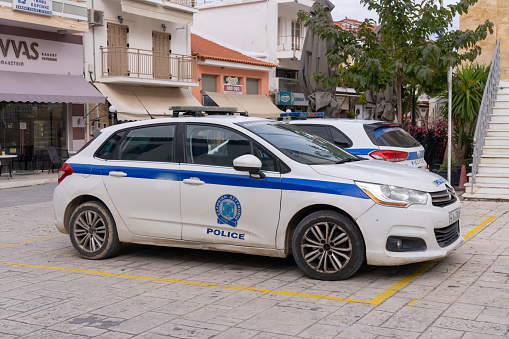 Koroni, Greece - 8 February 2023 - Police car parked in the center of Koroni town