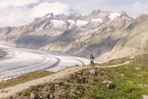 istock Trail runner bounds along mountain trail 1715014590