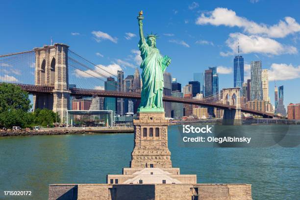Statue Of Liberty And New York City Skyline With Brooklyn Bridge Manhattan Highrises And World Trade Center Stock Photo - Download Image Now