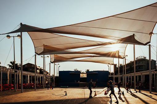 Valencia, Spain - July 6, 2021: Heat waves in summer impede outdoor activity, cities protect themselves with awnings from the sun.