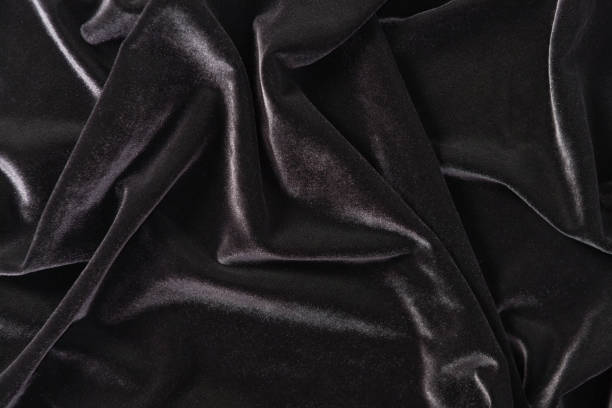 Crumpled black velvet: lustrous and luxurious background