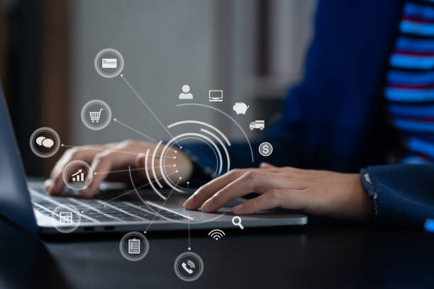 istock women working with smart phone and laptop and digital tablet computer in office with digital marketing media in virtual icon. 1715049025
