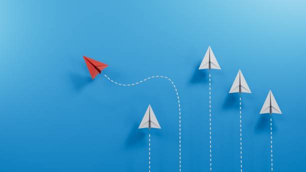 istock Different business concept. Red paper plane changing direction from white paper plane. new ideas. paper art style. creative idea.3D rendering on blue background. 1715052020