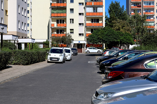 Warsaw, Poland - September 15, 2023: The cars were parked side by side in an outdoor car park in the Goclaw housing estate in the Praga-Poludnie district.