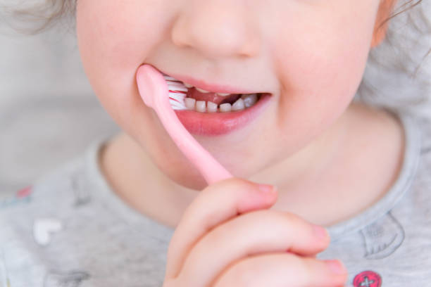 istock Child cleaning the teeth. 1715078975