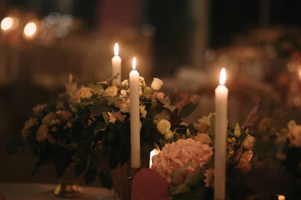 istock Dining table with flowers and candles 1715097752