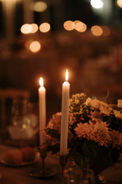istock Dining table with flowers and candles 1715098294