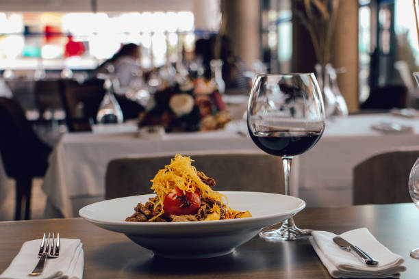 istock Food and red wine in luxury restaurant 1715108111