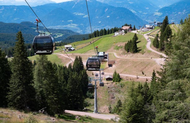 Merano, Italy - 8 August 2023: Merano 2000 station cable car mountain resort with moving cabins for the transport of passengers