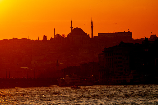 Silhouette of two mosques on the European side at sunset in the evening