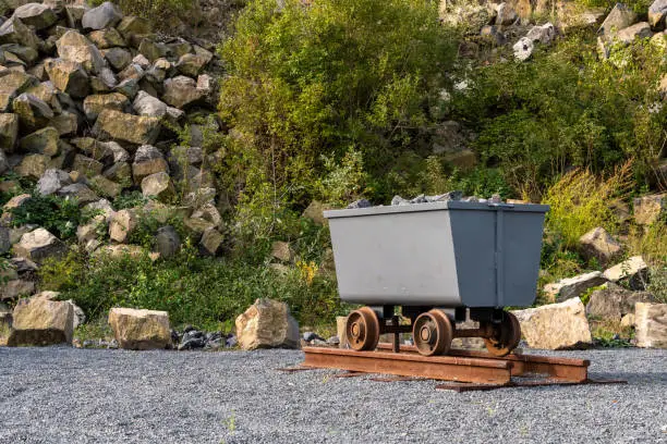 Photo of Mine cart full of rocks in an abandoned basalt quarry