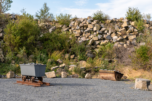 Mine cart full of rocks in an abandoned basalt quarry