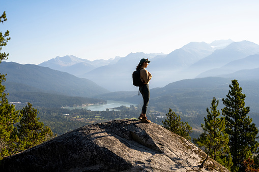 Solo female spending time in nature in nature. Hiking in Whistler, BC, Canada.