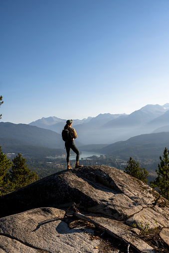 Solo female spending time in nature in nature. Hiking in Whistler, BC, Canada.