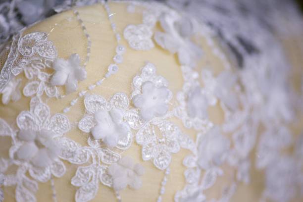 istock Lace and embroidery with beads on fabric 1715150734