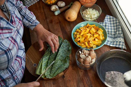 Cutting Kale on Wooden Board for the Holidays