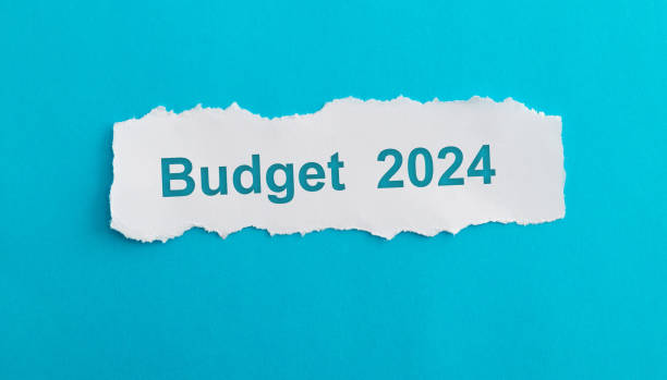 istock Text budget 2024 written scraps of paper on blue background 1715176684