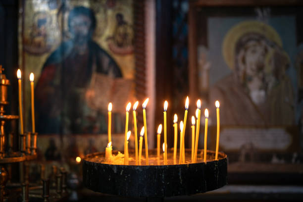 Burning candles in Orthodox church stock photo