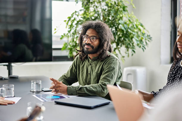 Bearded businessman listening during office meeting