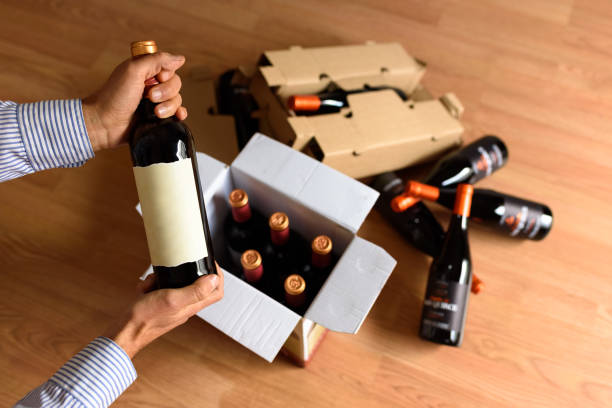 istock Cardboard box with quality wine bottles sent by post 1715208091