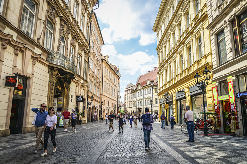 Prague, Czech Republic - May 9, 2018 : View to the street in the old center of Prague - the capital and largest city of the Czech Republic with people walking around