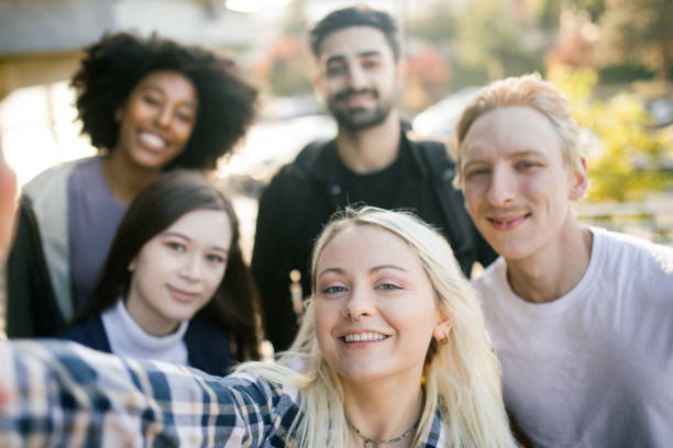 istock Group of Friends Take Selfie Together 1715232795