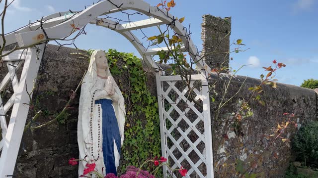 statue of Our Lady Praying at the little village of Killea Waterford Ireland on a Summer day