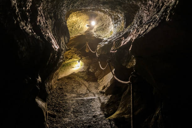 istock Interior of an underground cavern illuminated by spotlights. 1715263128