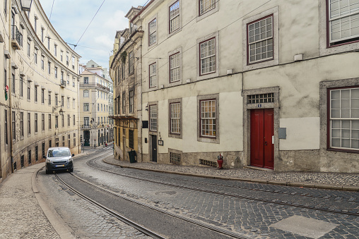 LISBON, PORTUGAL - JULY 4, 2019: Narrow cobblestone streets of the Chiado district in Lisbon, Portugal