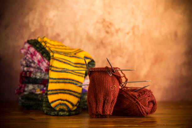 istock Colored yarn, knitting needles and other items for hand knitting . 1715268873