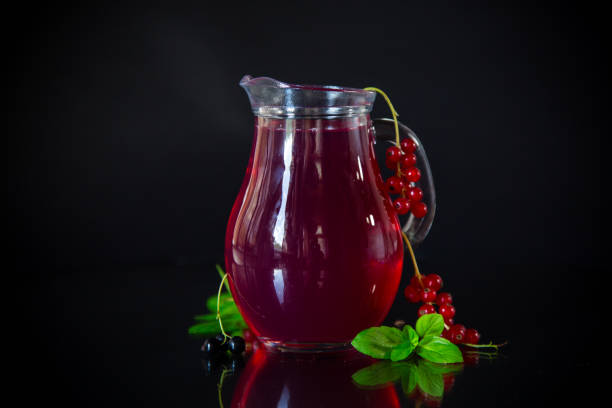 istock Cold refreshing drink from fresh summer berries in a decanter. 1715271837