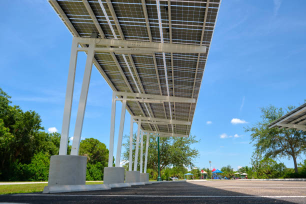 istock Solar panels installed over parking lot canopy shade for parked cars for effective generation of clean energy 1715281130