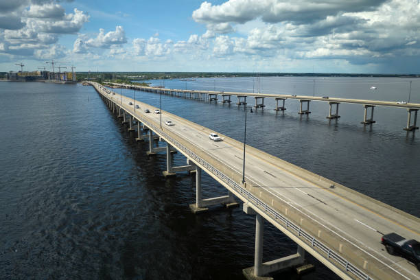 istock Barron Collier Bridge and Gilchrist Bridge in Florida with moving traffic. Transportation infrastructure in Charlotte County connecting Punta Gorda and Port Charlotte over Peace River 1715281134