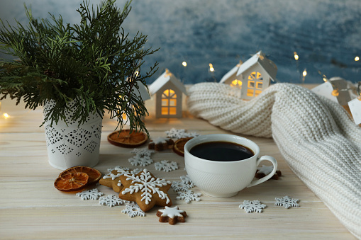 White cup of coffee with Christmas decorations. White and silver colours