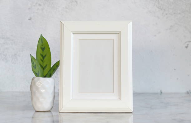 istock Mock up a picture frame on the table. 1715300269