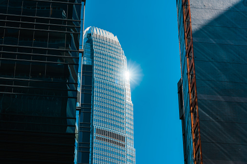 A corner of a modern skyscraper under the blue sky
